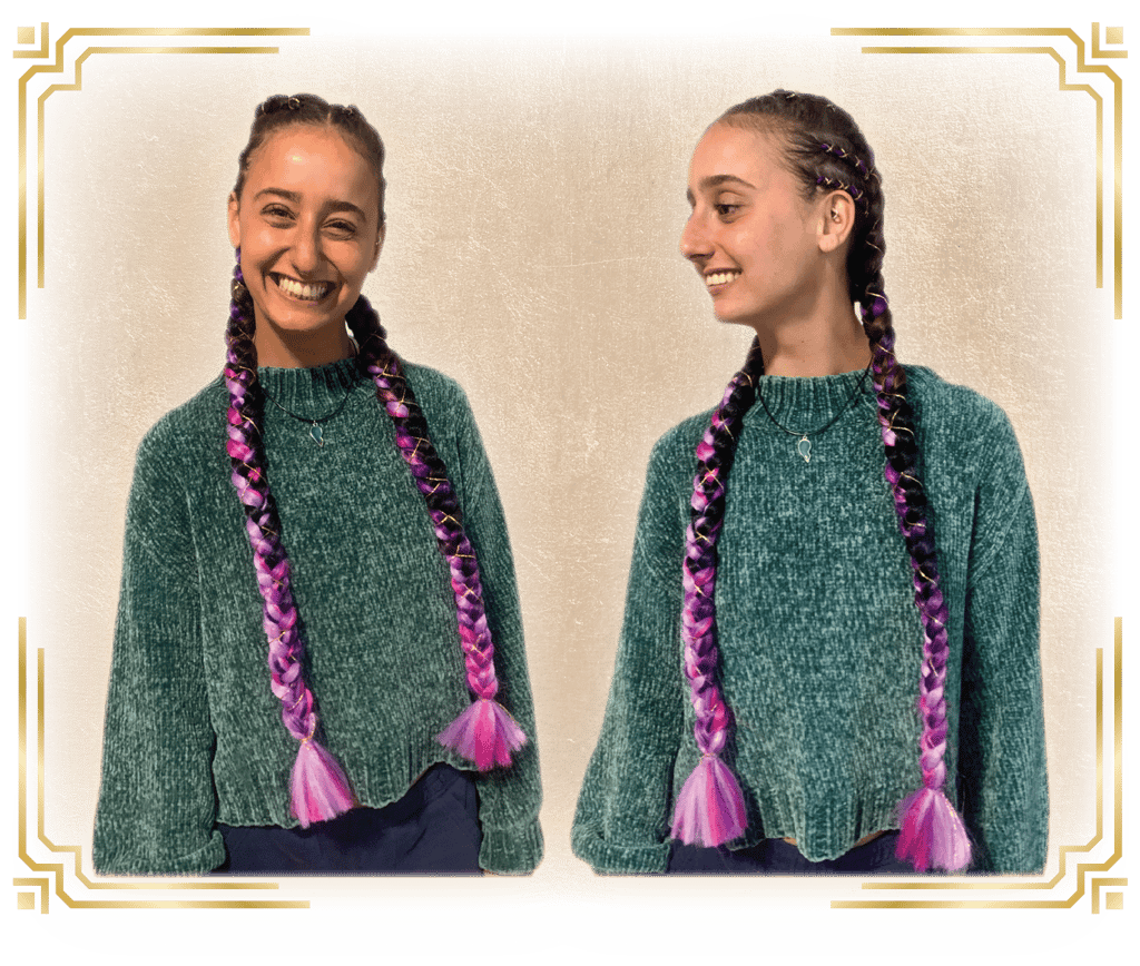 a woman with her hair done for a festival with braids and cornrows