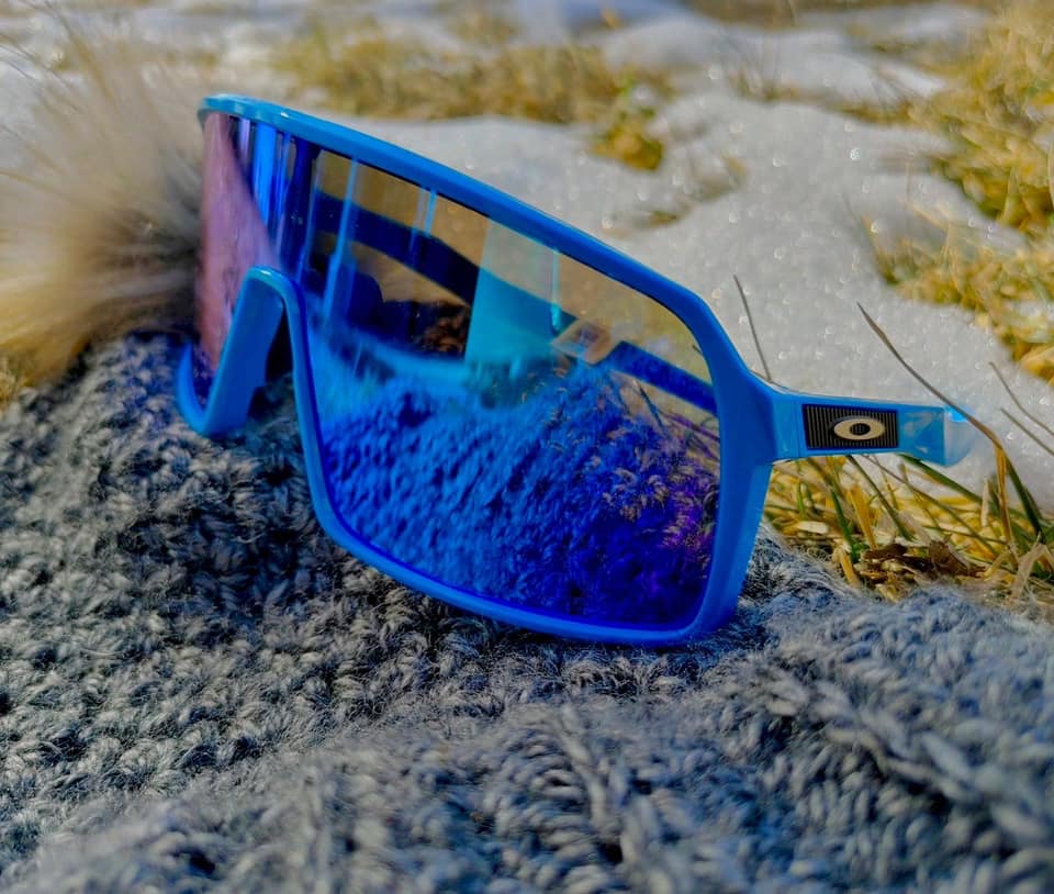 Oakley sports goggles sitting on a rock