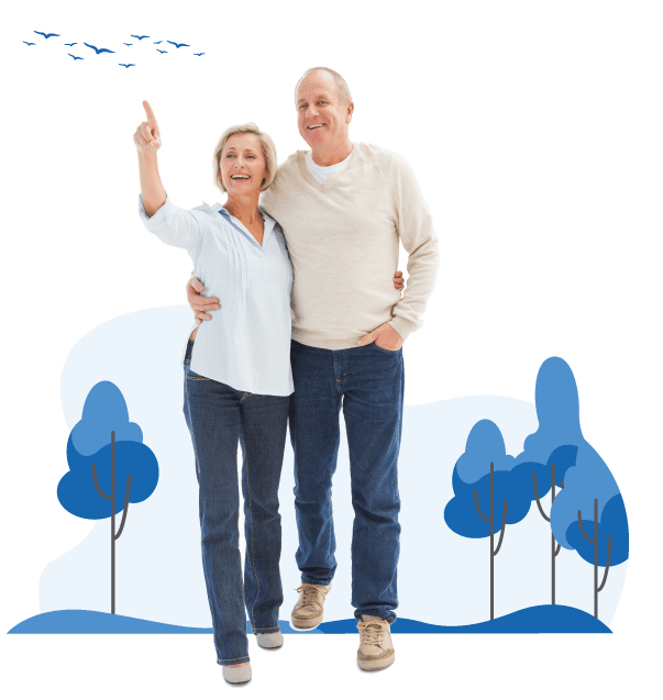 A happy senior couple walking outdoors together with the woman pointing towards birds in the sky.