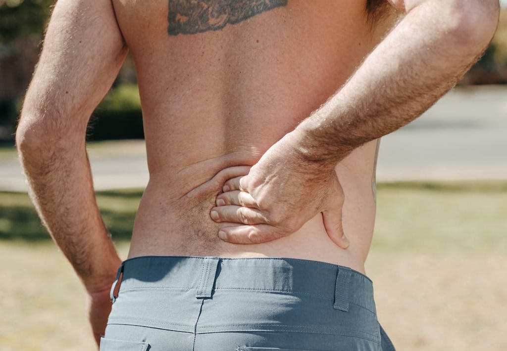 a man with a tattoo on his back