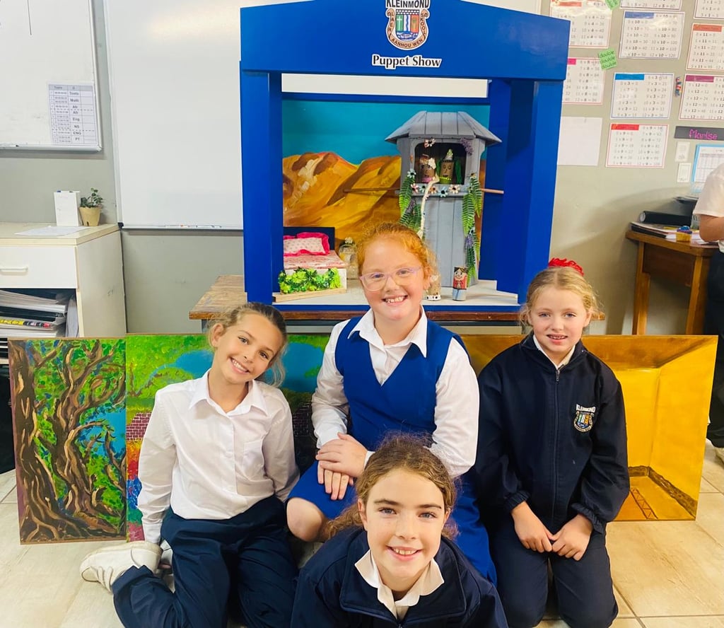 Children next to drama props
