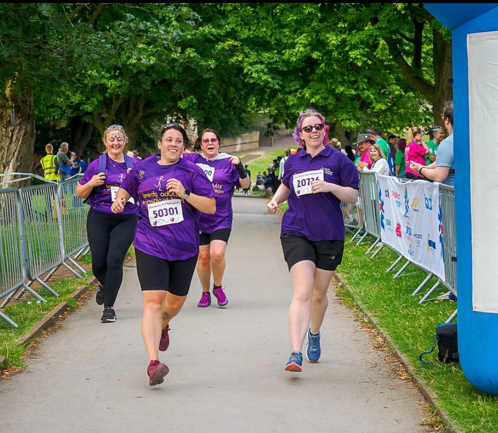 Team members running at the donor run