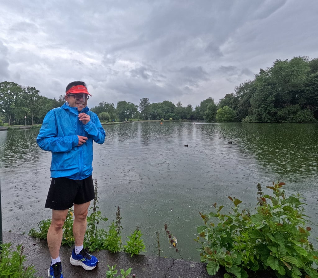 a man in a blue jacket and a red hat