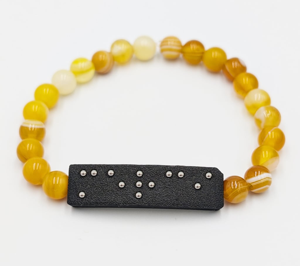 Bracelet perle Agate jaune chauffée, avec plaque braille Merci.