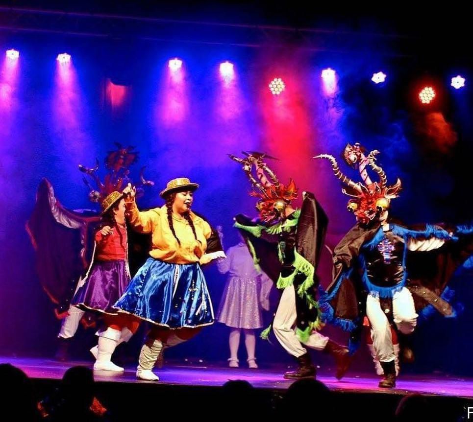 a group of people on a stage with a stage