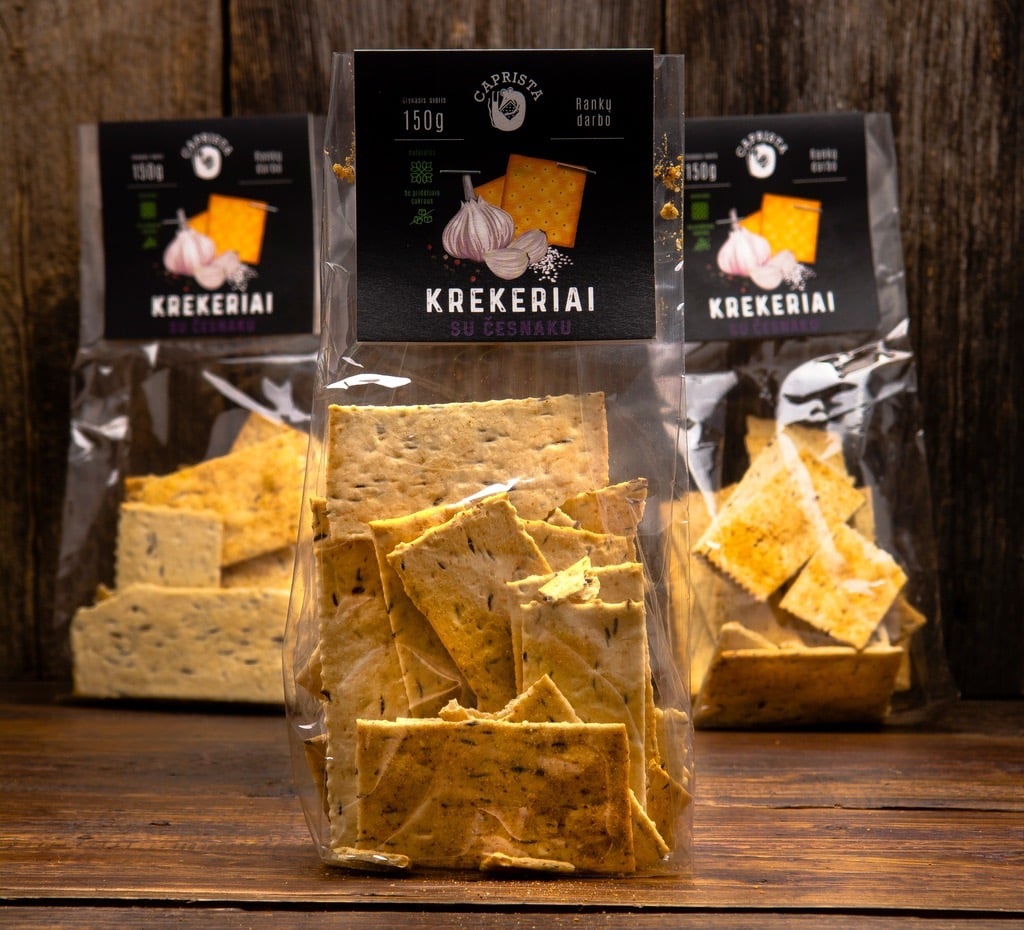 three  bags of crackers  on a table