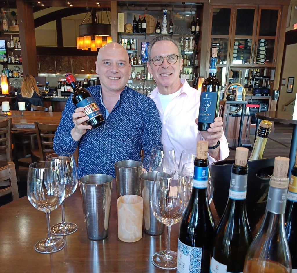 wine professional and wine producer showcasing their newly imported selections