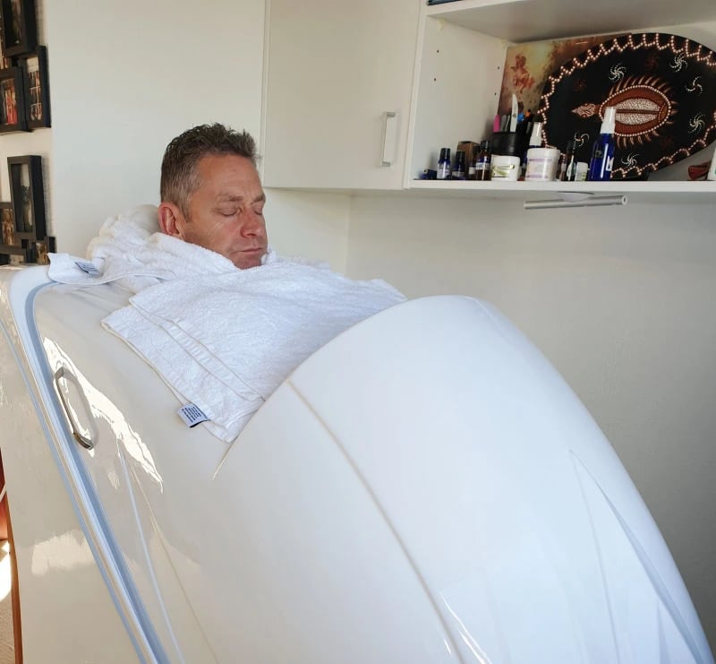 Person relaxing in ozone steam capsule, head exposed, symbolising Oxy‑detox support for cleansing and revitalising the body