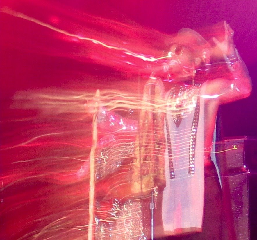 Live concert performance with visual effects on singer