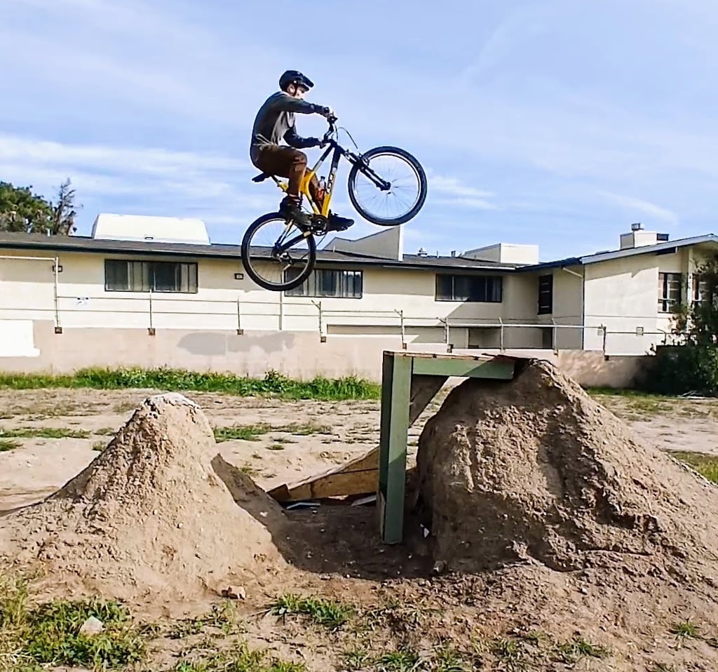 mtb rider jumping a double jump on full suspension
