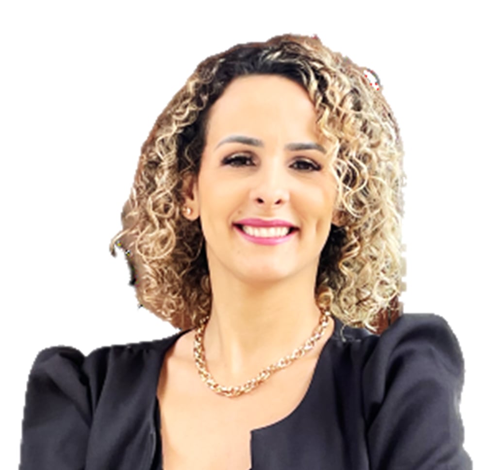 a woman with curly hair and a black jacket