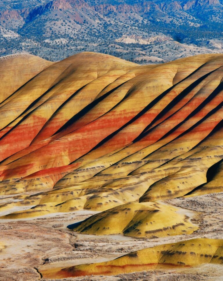 Vibrant layered desert rock formations in remote landscape, geological wonder and rugged outdoor terrain