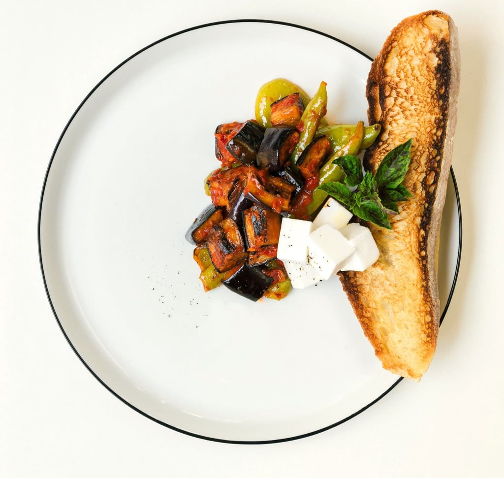 Vegetables with grated tomatoes served with feta cheese and bread- a dish by Villa Eats in Naxos 