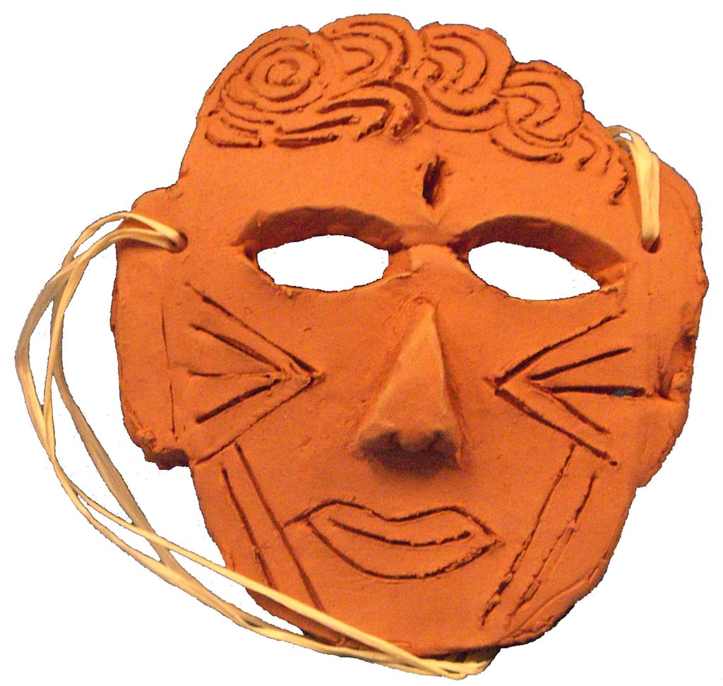 rolled clay made into a mask shape