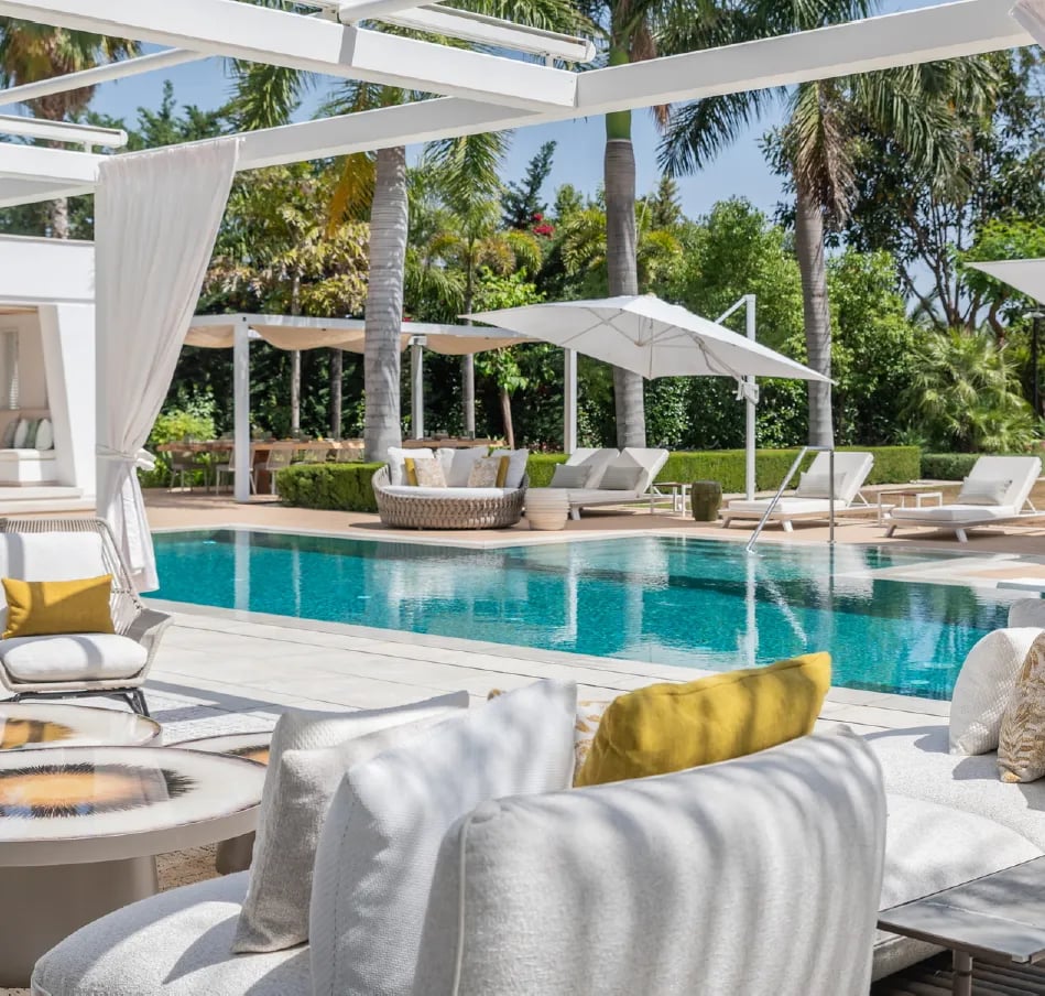 Luxury pool terrace with shaded lounges at Villa Serenity