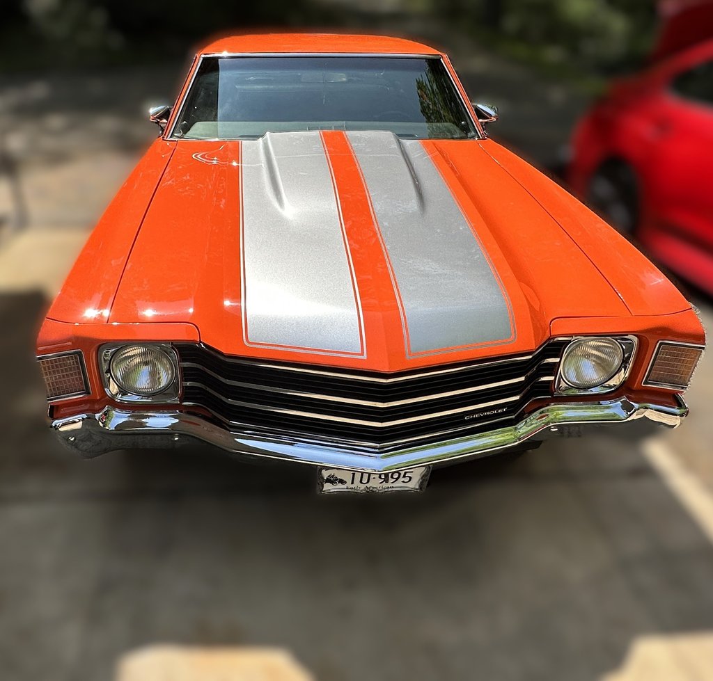 professionally mobile detailed orange muscle car with grey double stripes