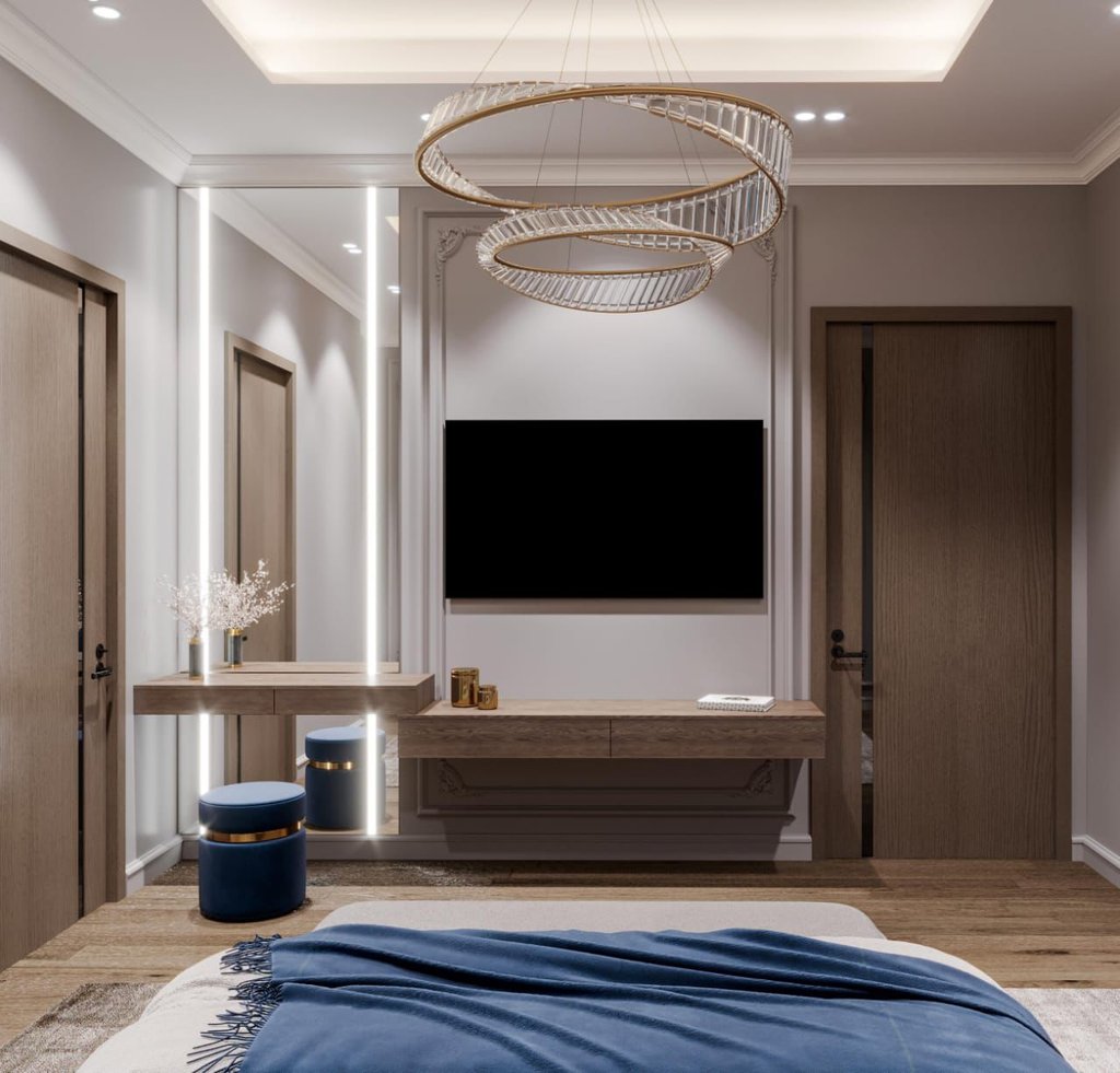 a bedroom with a large television and a large television