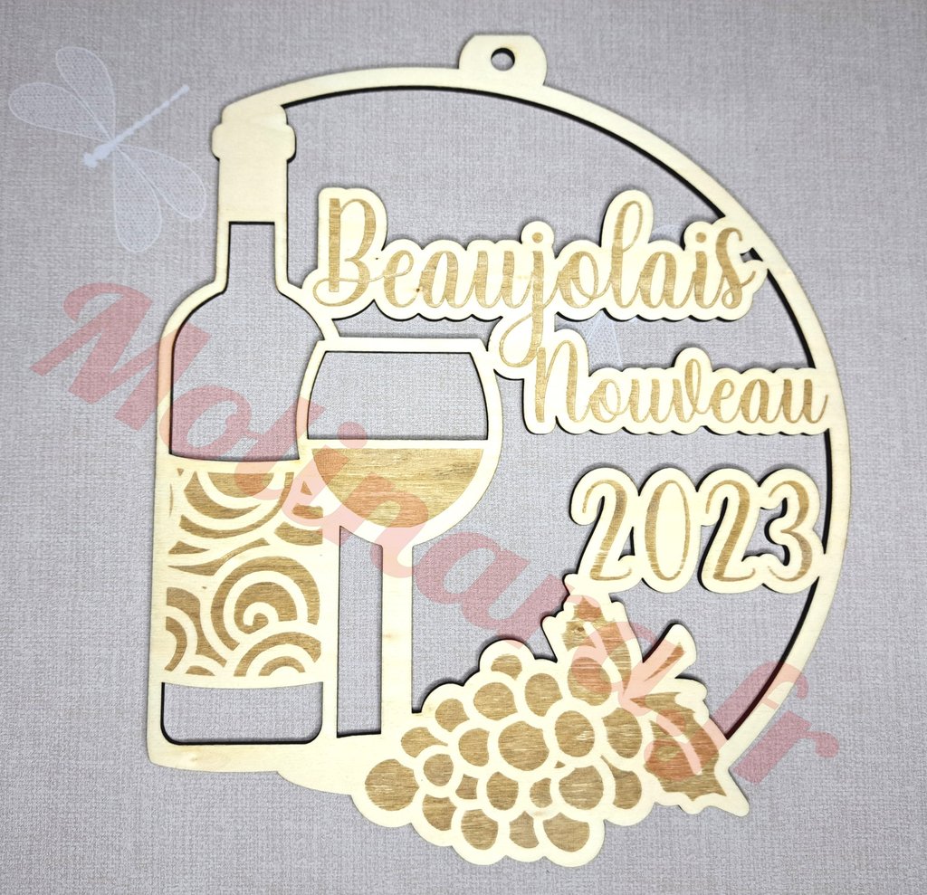 a wooden plaque with a wine glass and a bottle of wine