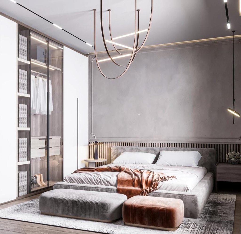 a bedroom with a large bed and a couch Nour Nagy Designs