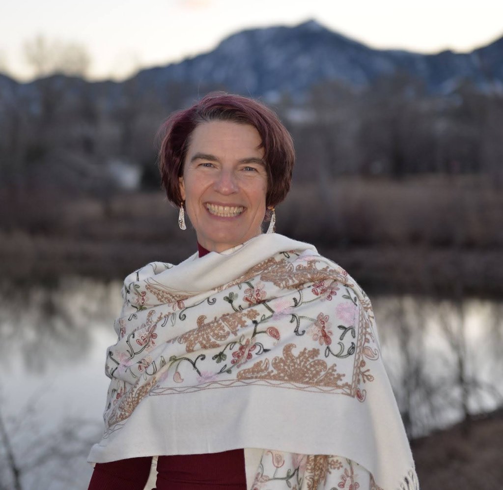 Kassandra white shawl water mountains. Photo by Kaylyn B