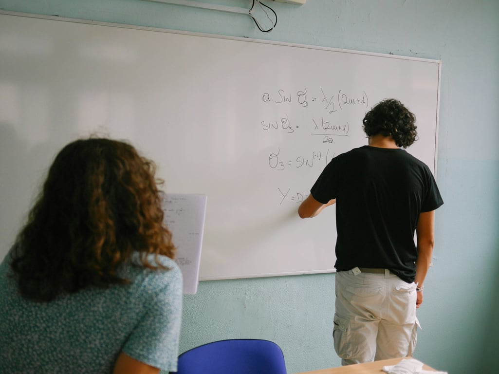 Cambridge Maths students using a growth mindset to get better at his academics as he writes