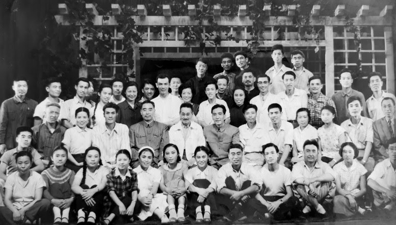 a group of people posing for a group photo