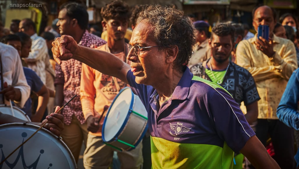 A person dancing to drums in panguni festival at Mylapore, Chennai