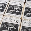 Handcrafted baby birth announcement cookies decorated with personalized details, perfect for celebrating a newborn