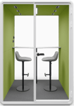 Type T-01: Two-person pod with high stools and a bar-height table, green interior walls