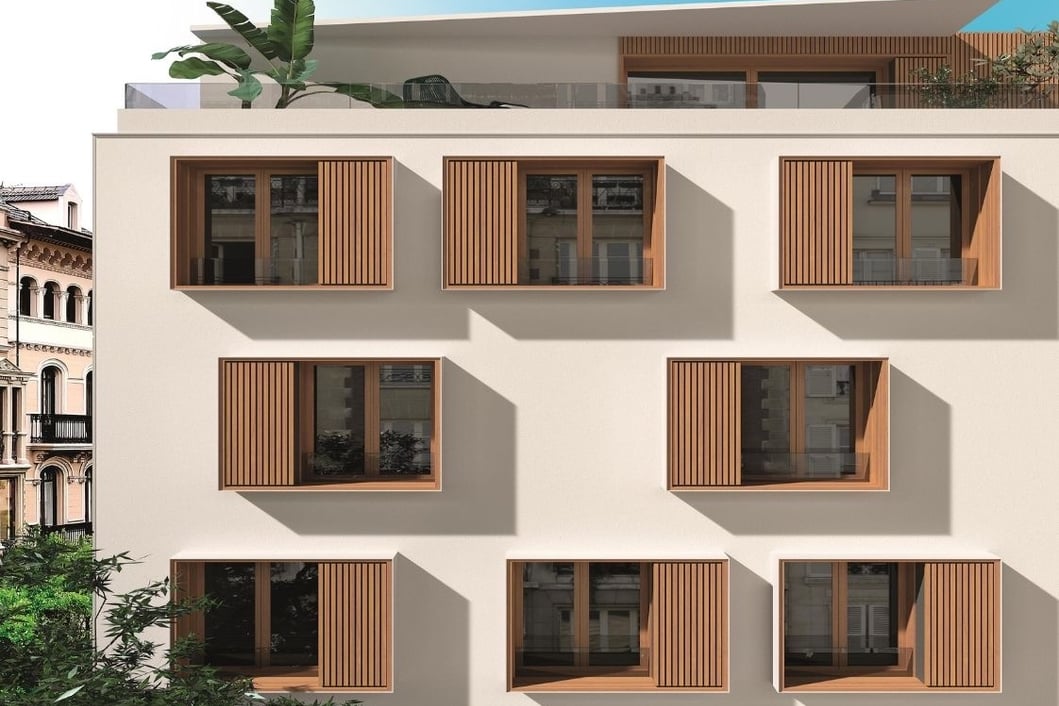 Edificio de apartamentos con volúmenes geométricos y cerramientos exteriores de líneas limpias