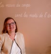 a woman in glasses and a white shirt
