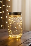 Glass jar filled with glowing LED fairy lights