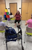 Rachel teaching gentle chair yoga class at Micco library