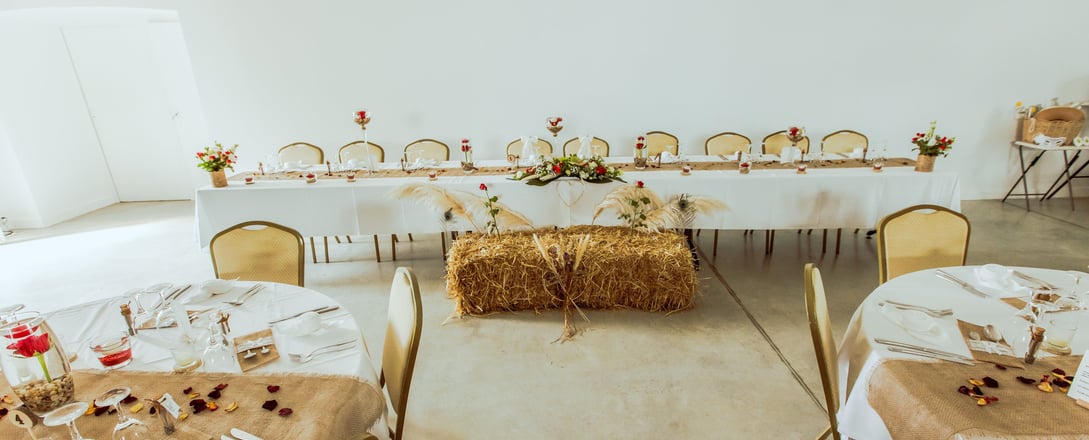 a table with hay bale and hay bale