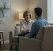 Hypnotherapist talking with client during a clinical hypnotherapy session