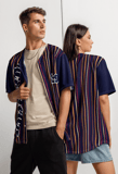 a man and woman standing next to each other wearing YESHUA Apparel jerseys