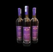 three bottles of donelli bevanda arromatizza wine with a purple label on them