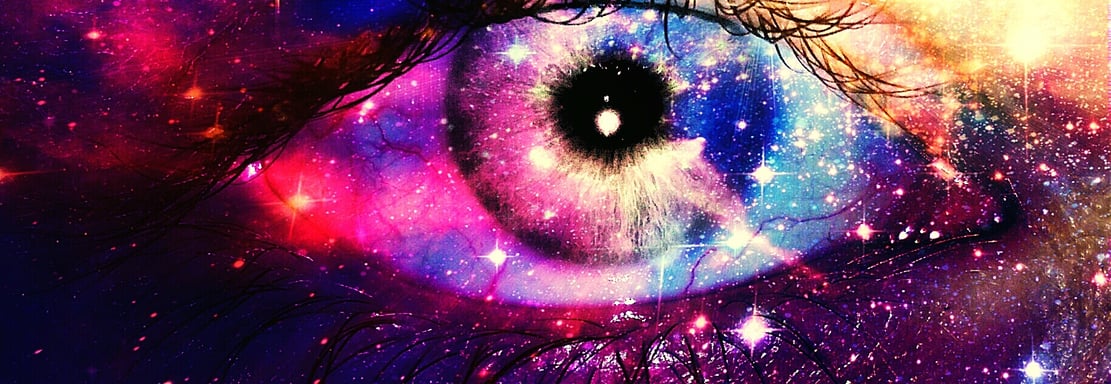 a person's eye looking at a galaxy - like eye