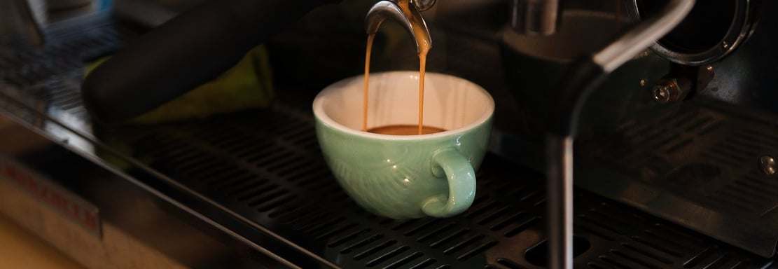 La Marzocco coffee machine is being used to make a cup of coffee