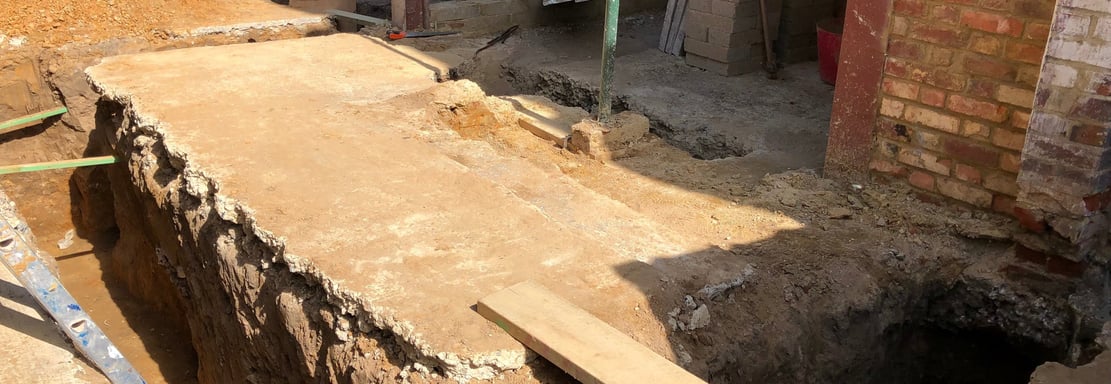 Groundwork contractor overseeing foundation work