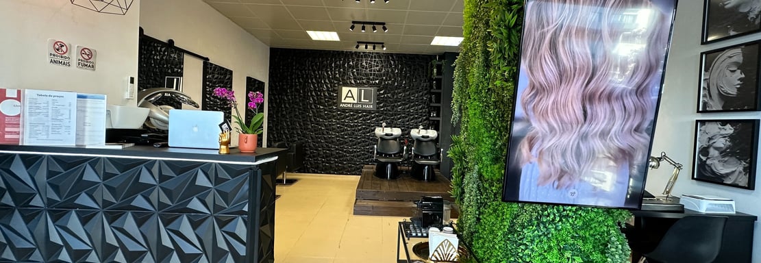 a salon and spa with a green wall