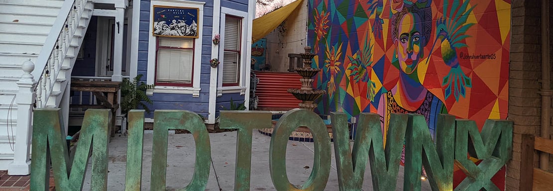 artistic photo capture of a sign that reads "midtown"