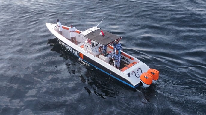 a boat with people on it in the water