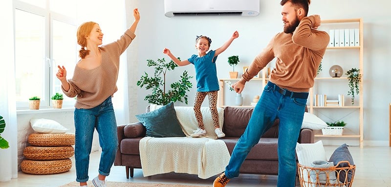 a man and woman playing with a remote control system