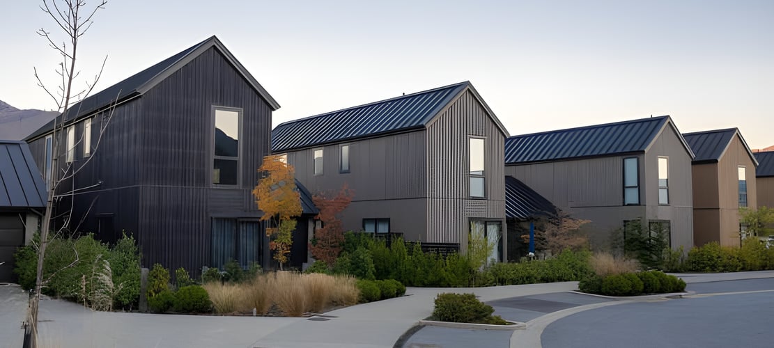 Modern townhouses in a landscaped neighborhood, representing residential property assessments