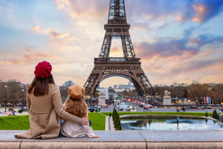 A breathtaking view of Paris featuring the iconic Eiffel Tower standing majestically against the bac