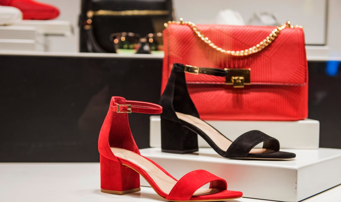 a pair of red shoes and a purse