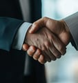 business men shaking hands signaling trust and being legit
