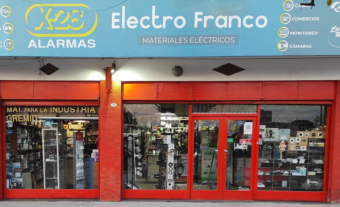 a store front door of a store with electronic equipment