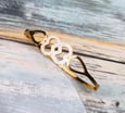 Bracelet coeurs enlacés en acier inoxydable a prix doux, cadeau idéal.
